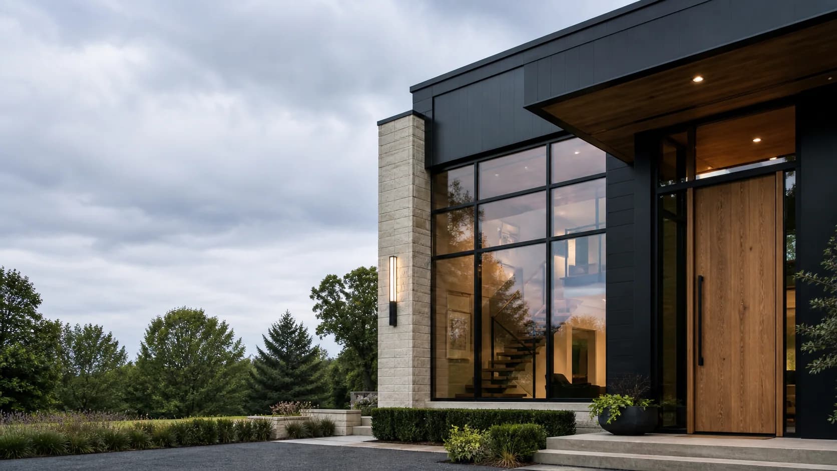 Illustrative contemporary home exterior with black-framed windows and a wood entry door