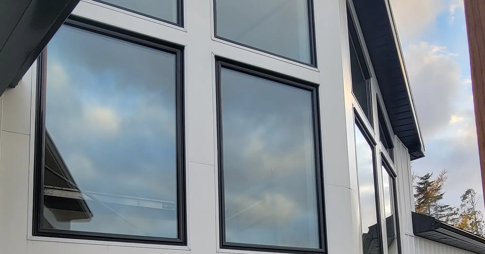 Black-framed windows on a modern home, a Better View install