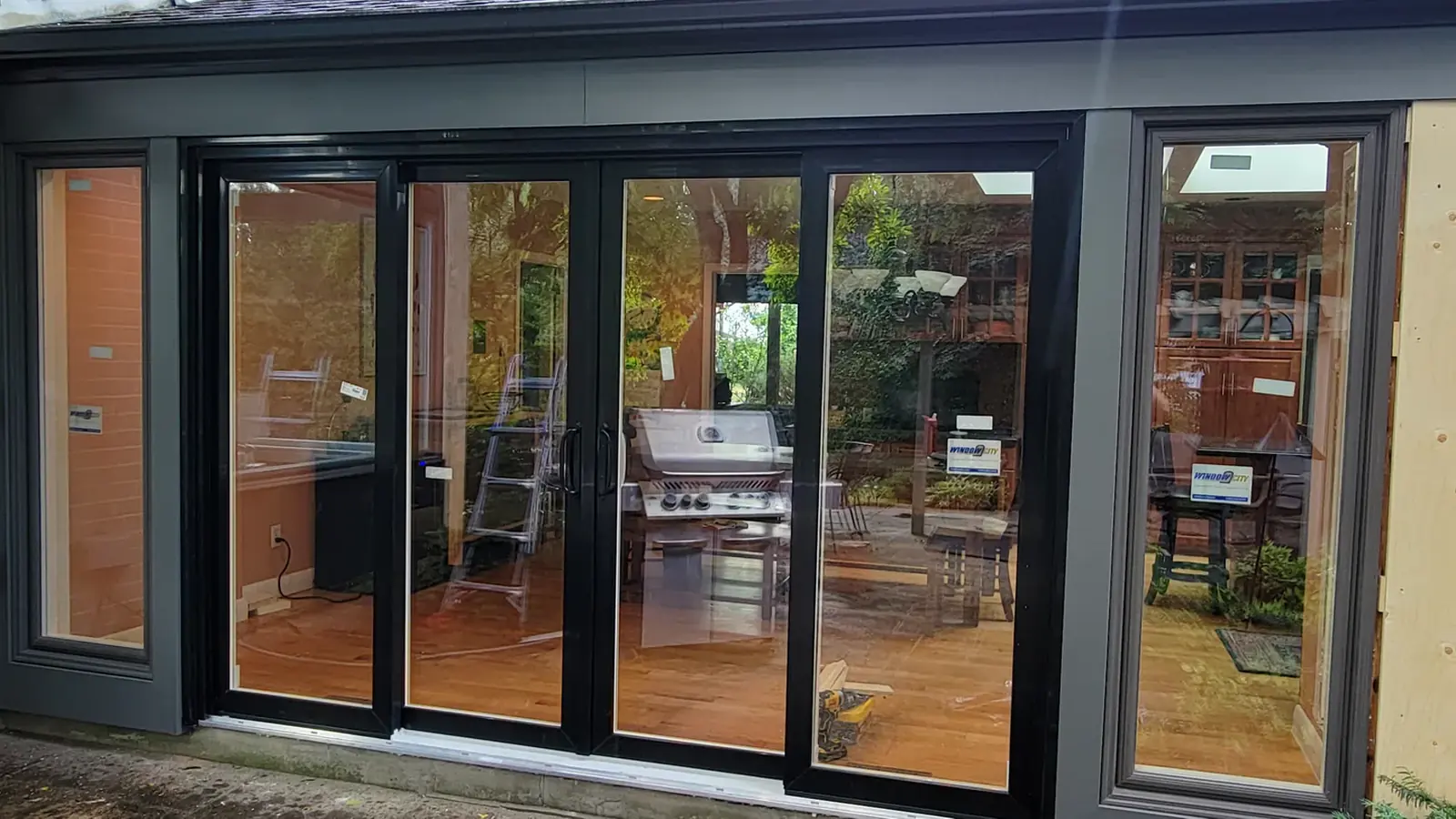 Four-panel black patio door