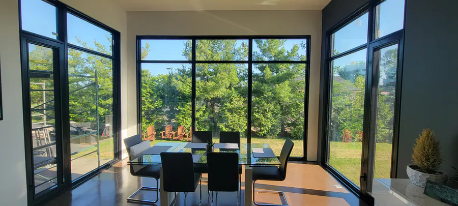Black aluminum glass corner around a dining room