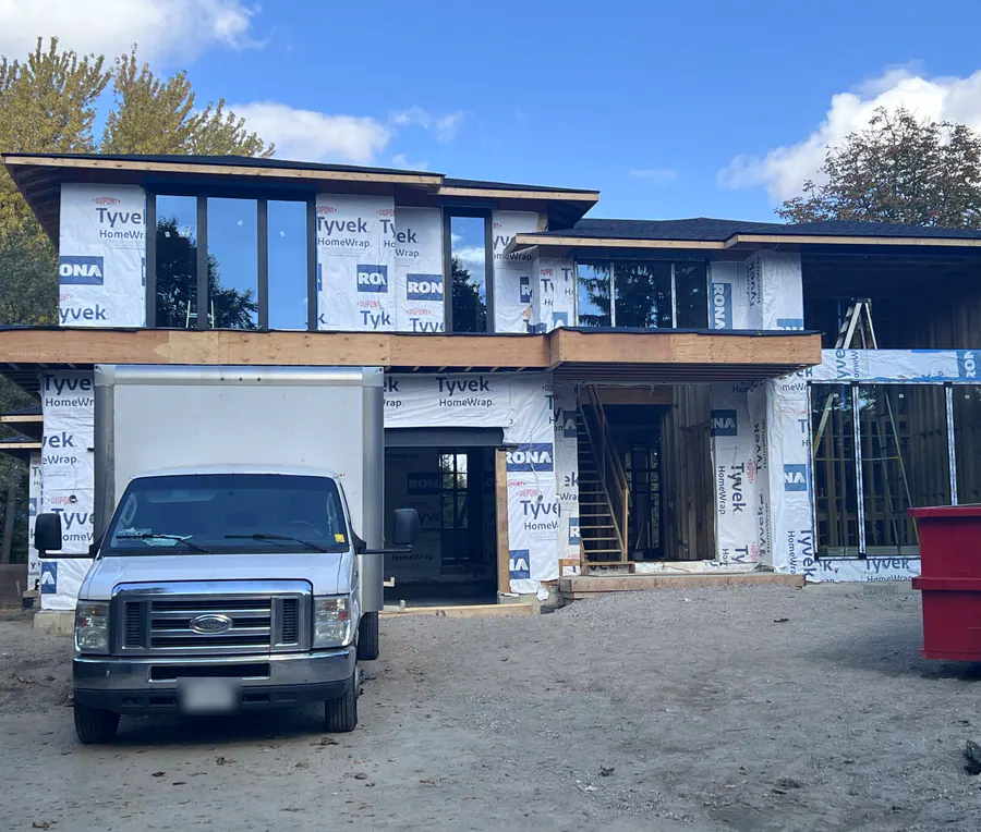 Black aluminum windows on a new custom home in the GTA during installation