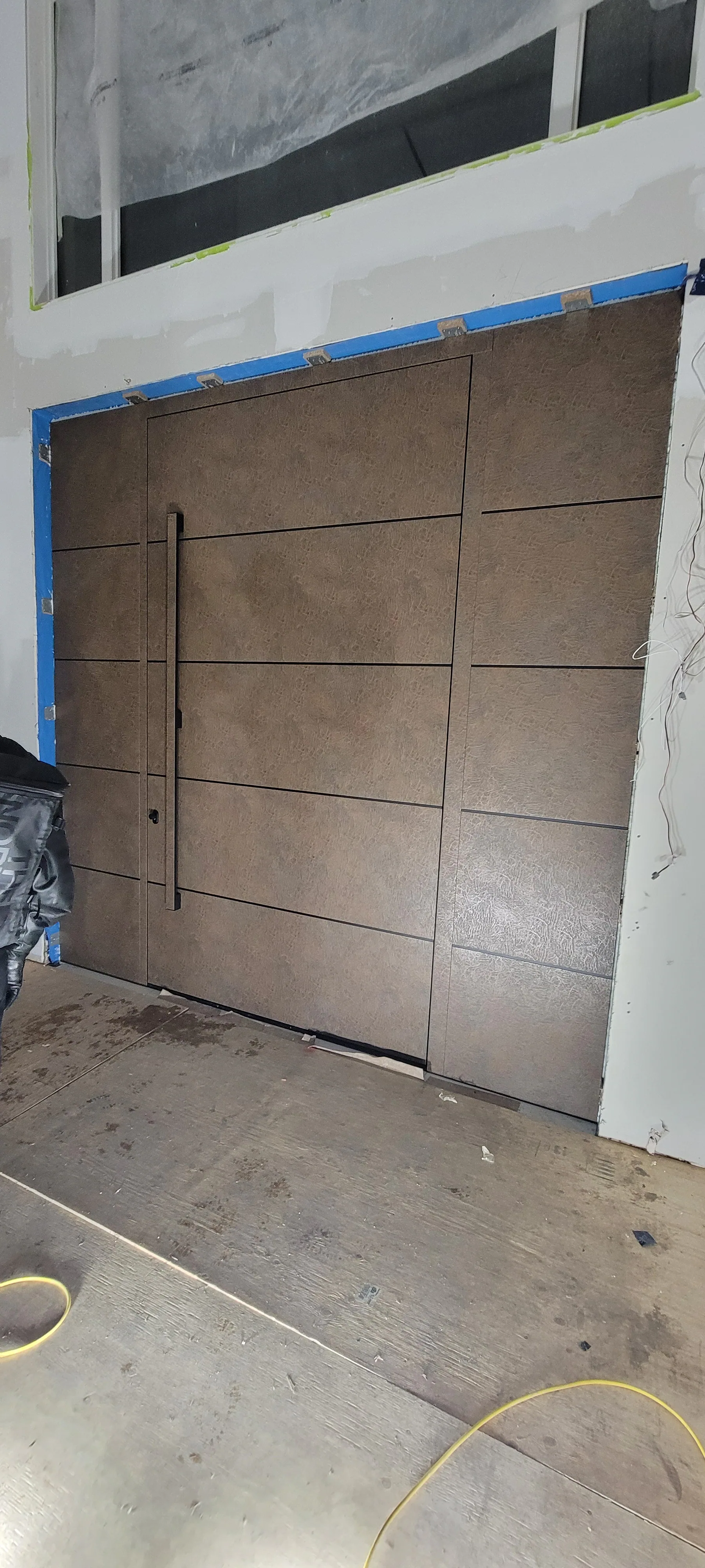 Wood-look pivot door installed by Better View