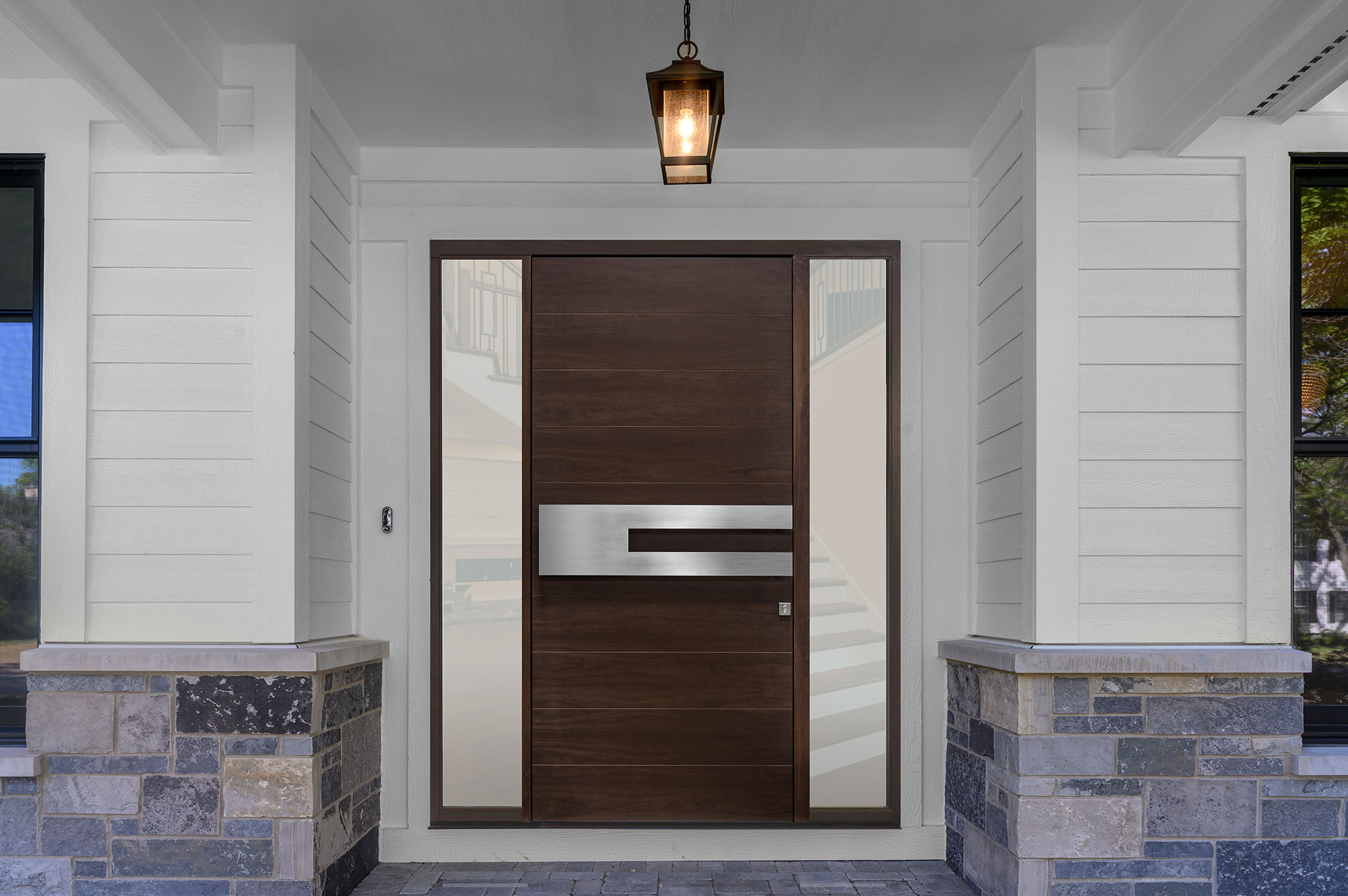 Custom wood door detail with warm finish
